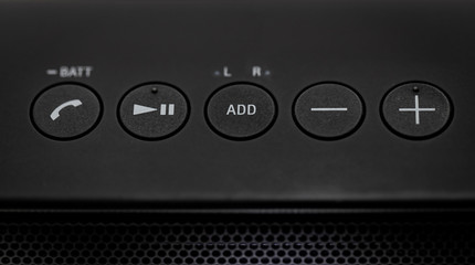 Black Bluetooth speaker with lights on isolated in white background