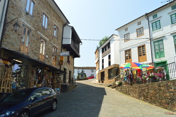 Streets With Slate Buildings With Shops On Its Ground Floor Leading To A Beautiful Square In Taramundi, Asturias, Spain. Architecture, History, Travel. August 2, 2018