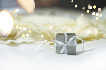 Fototapeta na wymiar Christmas gift box with garlands.