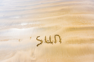  inscription on sand sun