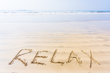 The inscription on the sand relax