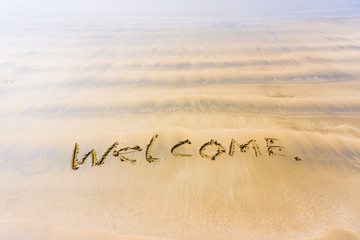 The inscription on the sand welcome