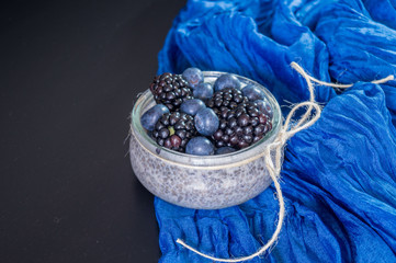 blueberries and chia pudding on the table