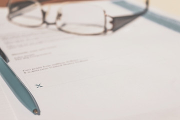 Fototapeta premium Pen on legal document awaiting signature.