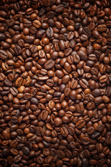 Texture spilling coffee beans. Top view. Copy space.