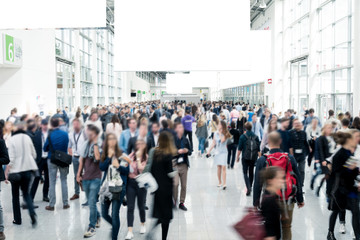 blurred business people at a trade fair