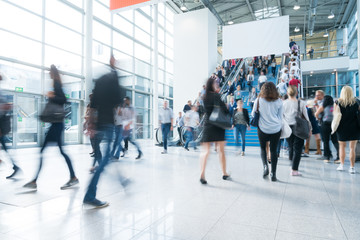 blurred business people at a trade fair