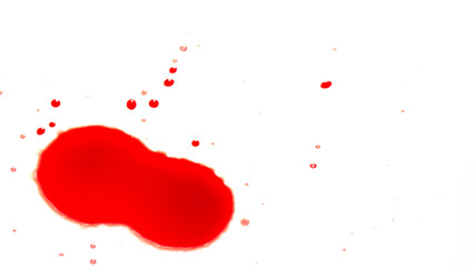 drops of red blood on white paper