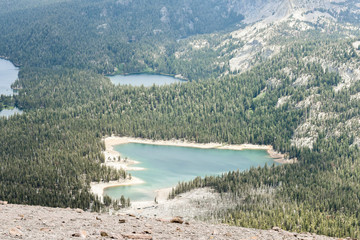 Looking down on a valley with the sub-alpine lakes of Mamie, Mary, George, and Horseshoe from the top of Mammoth Mountain, California © NatalieJean