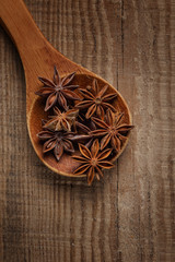 anise in a wooden spoon. Top view. Copy space.