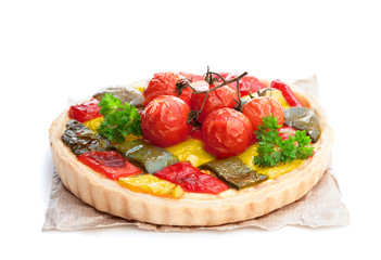 Vegetarian quiche with colored pepper and cherry tomatoes isolated on white
