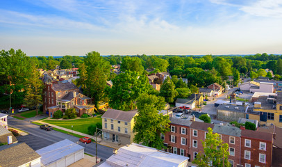 Fototapeta na wymiar Aerial view of suburban houses and sunset sky - West Chester, Pennsylvania, USA