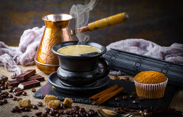 Black coffee in a composition with kitchen accessories