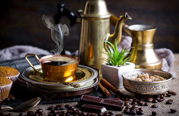 Black coffee on old background