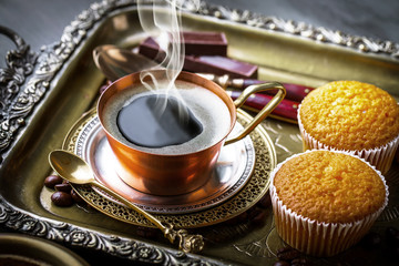 Black coffee on old background