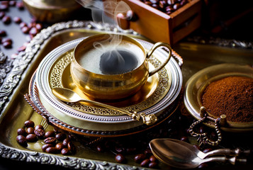 Black coffee in a composition with kitchen accessories