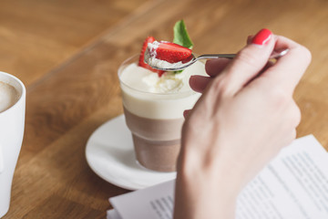 Coffee dessert with strawberry and leaves of mint