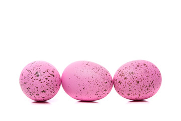 A group of pink Easter Eggs with speckles on a white background