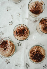 Homemade chocolate mousse portioned in small glasses. Festive dessert, Christmas dinner.