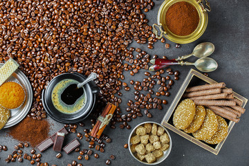 Black coffee in a cup on old background