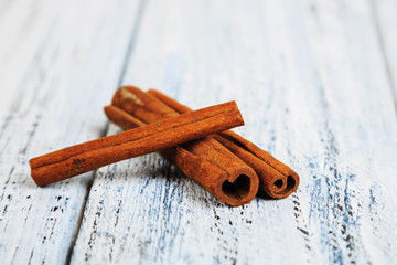 cinnamon sticks on wooden table