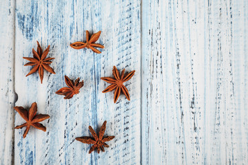 star anise flowers on wooden table