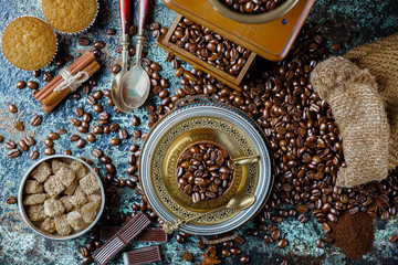 Black coffee in a cup on old background