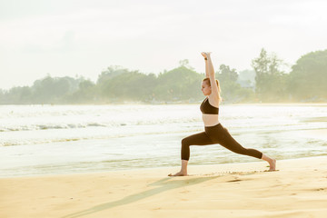 Fototapeta na wymiar girl doing fitness on the beach