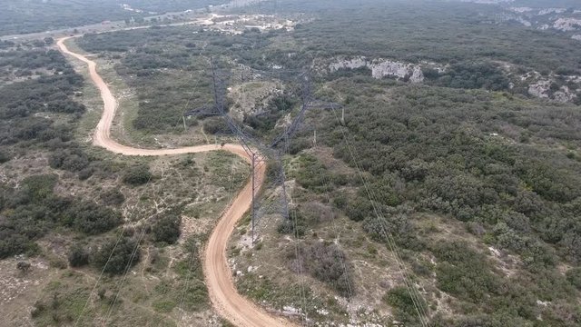 Aerial view of high voltage power line in garrigue  France. 