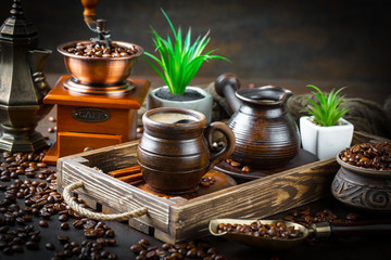 Black coffee in a cup on old background