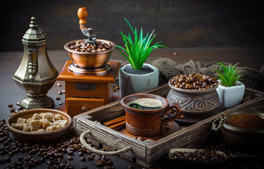 Black coffee in a cup on old background