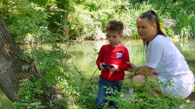 The boy is played radio-controlled toy