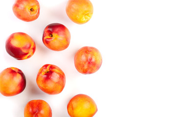 ripe nectarine with leaves isolated on white background with copy space for your text. Top view. Flat lay pattern