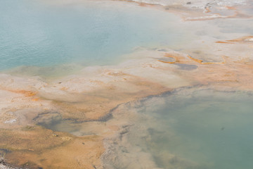 Yellowstone national park landscape. Geothermal activity, hot thermal springs with boiling water and fumes at Yellowstone National Park, USA