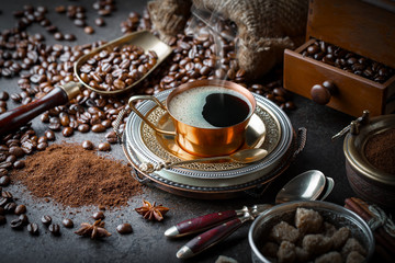 Fototapeta na wymiar Black coffee in a cup on old background