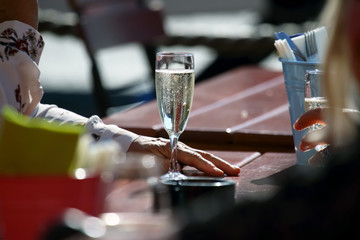 people communicate on the street with glasses of champagne © photosaint