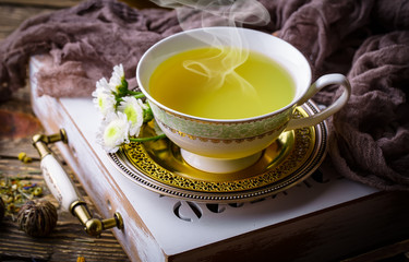 Tea in a cup on an old background