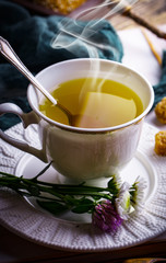Tea in a cup on an old background