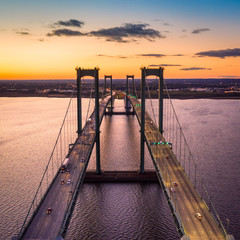 Aerial view of Delaware Memorial Bridge at dusk. The Delaware Memorial Bridge is a set of twin...