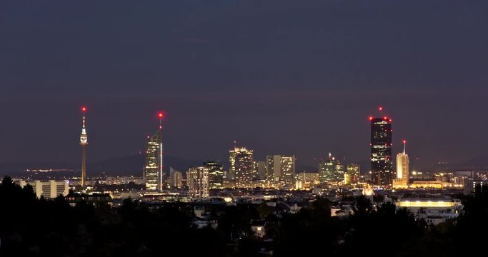 Evening scene of the skyscrapers of Vienna, Austria. Day to night transition time-lapse of cityscape.