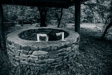Dead zombie girl climbs out of the well