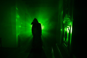 Horror silhouette of ghost inside dark room with mirror Scary halloween concept Silhouette of witch...
