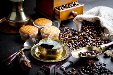 Black coffee in a composition with kitchen accessories