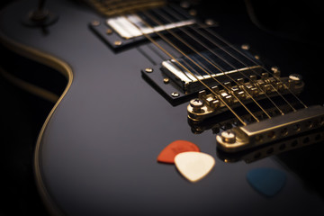 Black electric guitar closeup