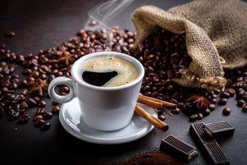 Black coffee in a composition with kitchen accessories