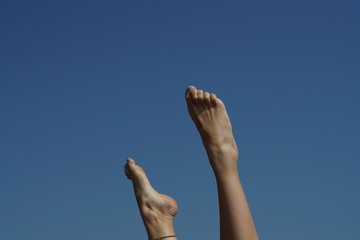 low angle view on feet in the sky