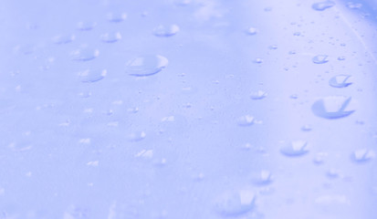 Blue water drops background selected focus on clear surface