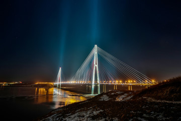Amazing zooming out aerial view of the Russky Bridge, the world's longest cable-stayed bridge, and...