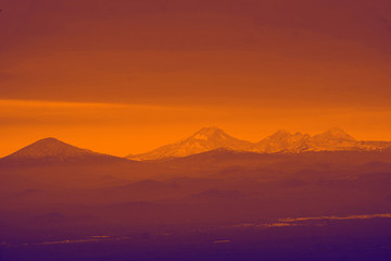 Morning haze on the Three Sisters and other Cascade volcanic peaks