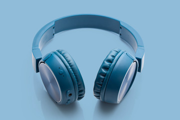 bluetooth blue headphone on blue background